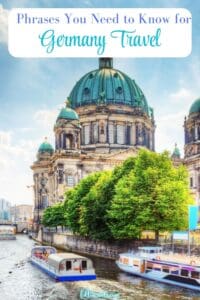German Phrases to Know - This image is a Pinterest Pin with an image of the Berlin Cathedral with boats in the canal on the left side and the title reads, "  Phrases You Need to Know for Germany Travel"