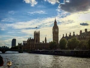 This image features a view of Big Ben and the Parliament building at sunset from a Thames River cruise. This photo was taken by Lisa Soots.