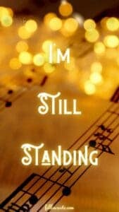 I'm Still Standing Lyric on glowing gold sheet music background. Designed by Lisa Soots