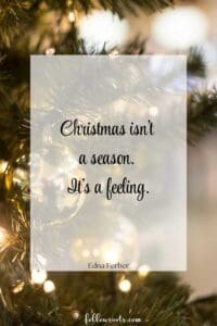 This image is a Christmas quote with a Christmas tree with lights and gold Christmas ornament. The quote says, "Christmas isn't a season. It's a feeling."