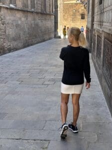This is an image of Lisa Soots walking in the Gothic Quarter of Barcelona.