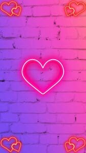 Pink Aesthetic Wallpapers - Image of a brick wall glowing with pink neon hearts