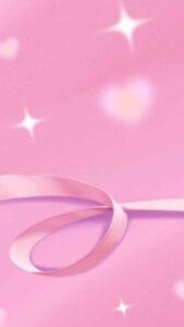 This is an image of a pink background with a pink ribbon laying on the bottom with pink hearts and sparkles 