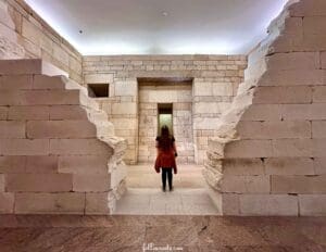This imge features a woman observing an Eygtian Exhibit inside the Metropolitan Museum of Art in New York City. Photo by Lisa Soots