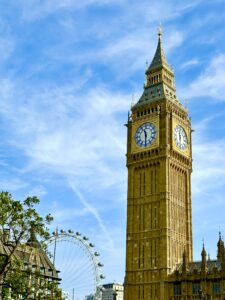 This image features Big Ben prominently the foreground with the London Eyeing the background on the left, with a vibrant blue sky around them. Beautiful Travel Aesthetic Wallpapers