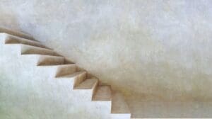 This image features a stone staircase with muted nuetral gray colors