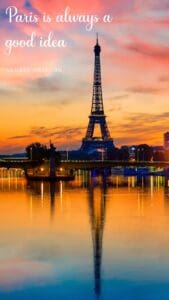 This image features the Effiel Tower reflecting over the Seine River after sunset