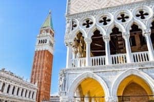 View of St. Mark's Campanile and Venetian Gothic details in Venice, Italy.