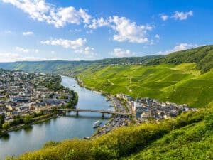 This image features a view from Landshut Castle above  Bernkastel-Kues and the Moselle River Valley.