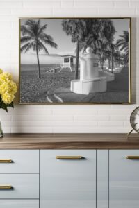 This image features a framed black and white print of the promenade in Fort Lauderdale with a lifeguard stand on the beach in the background. - Coastal wall art printable — Fort Lauderdale Promenade